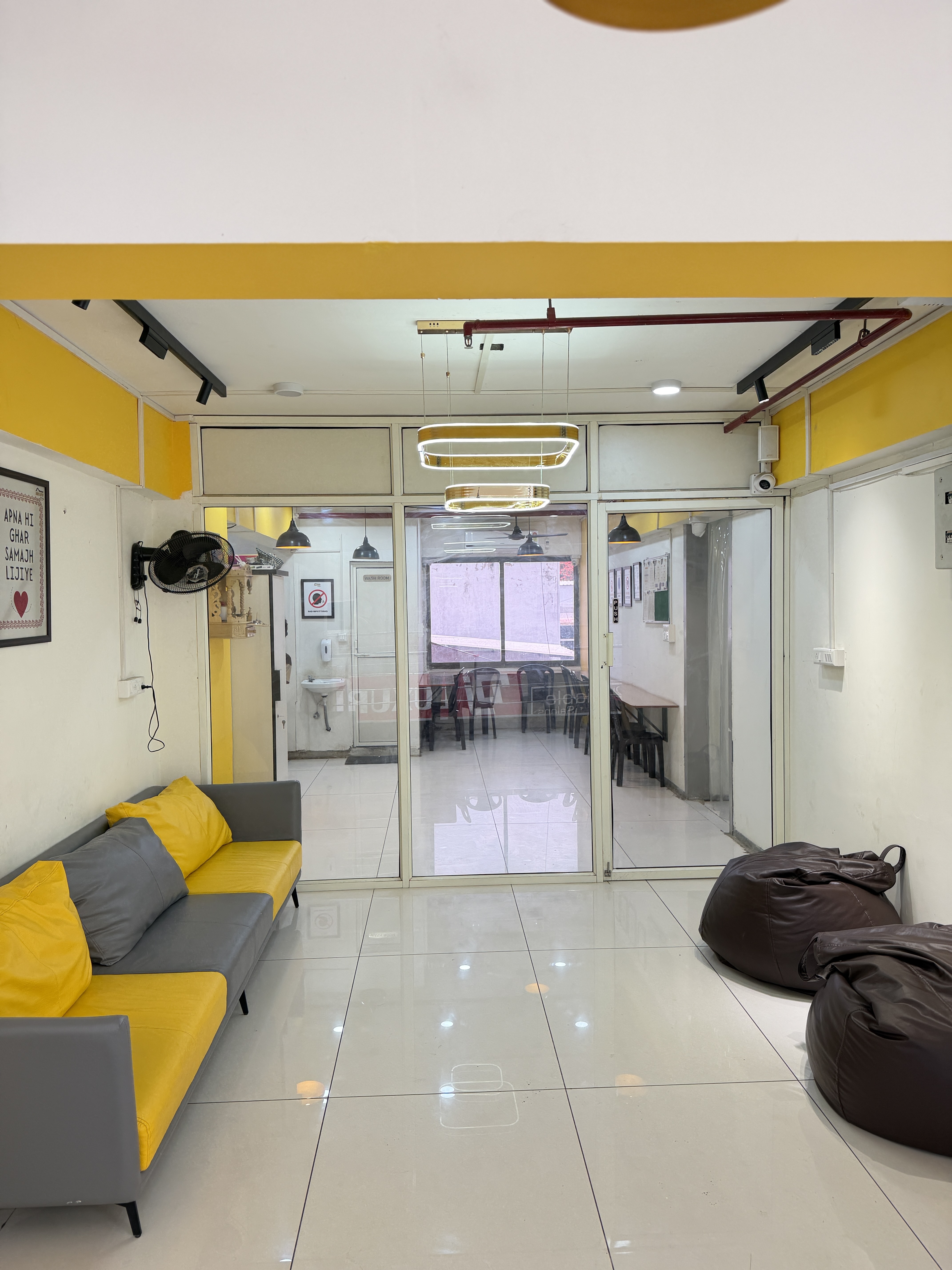 Common lounge with sofa and hangout zone, Gurukul Road PG